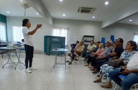 Presenter addressing residents of Sections 11 and 12